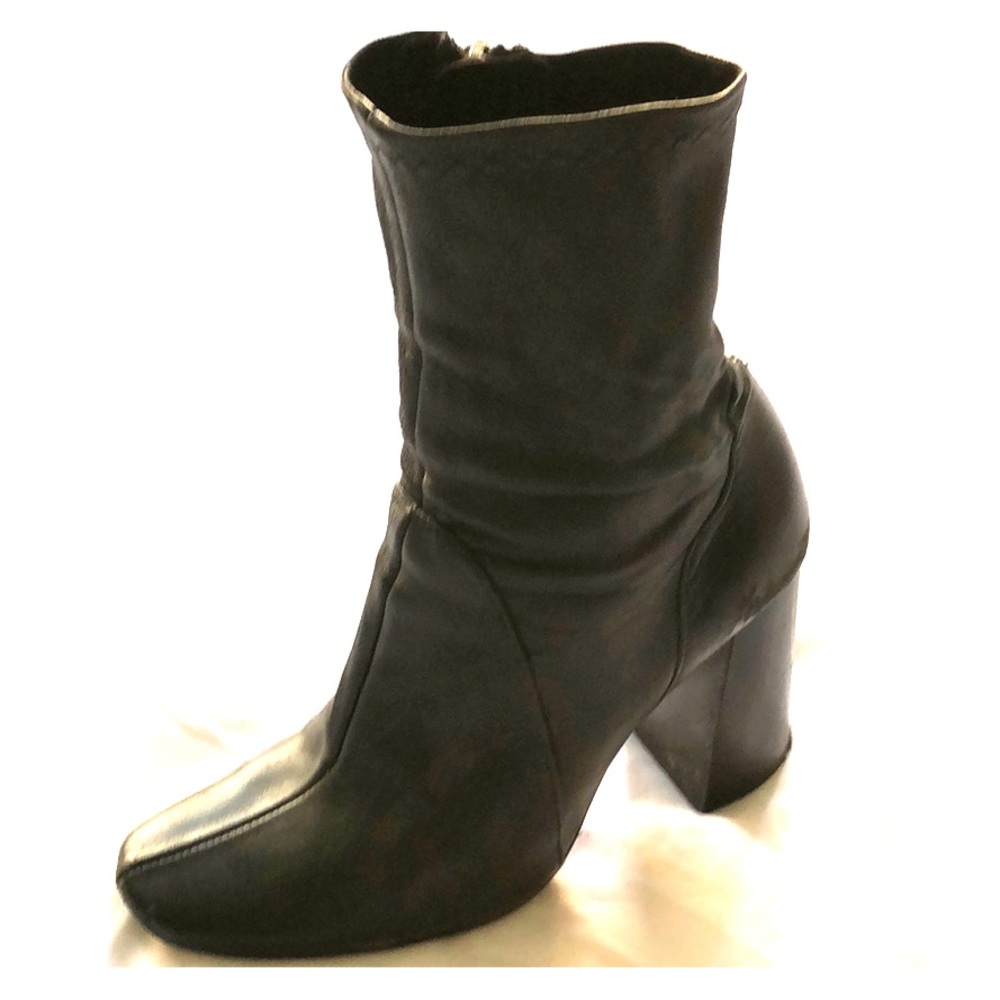 Black leather heeled boots by Zara